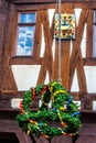 Easter wreath and coat of arms at the town hall in Michelstadt, Odenwald